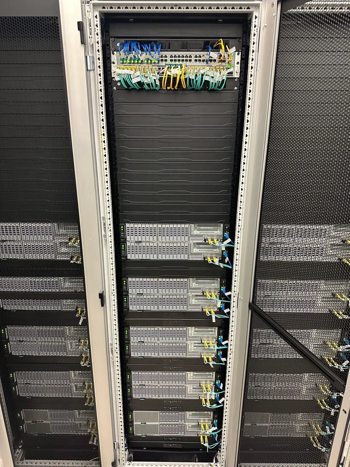 A neatly built and patched server rack in a datacenter