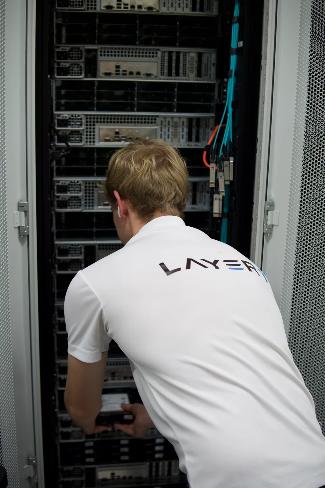 Layer One engineer building out a server rack on site